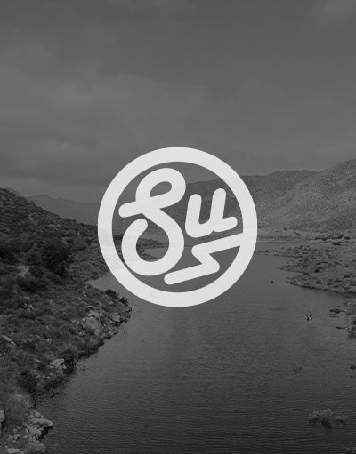 ANETIK x Swimbait Underground partnership logo over river canyon landscape
