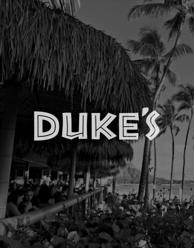 ANETIK x Duke’s partnership logo over beachfront restaurant with palm trees