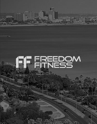 ANETIK x Freedom Fitness partnership logo over coastal city waterfront