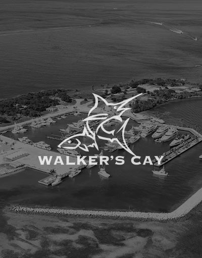 ANETIK x Walker’s Cay partnership logo over aerial marina and island